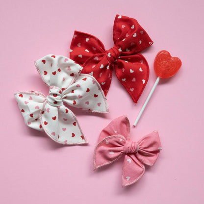 Three sailor bows with heart pattern